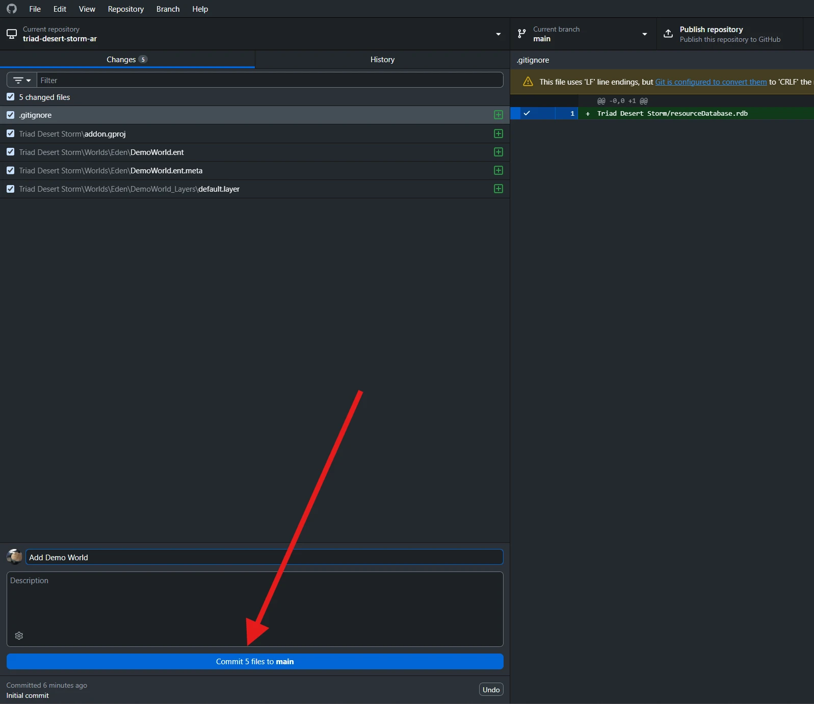 Project files and .gitignore are checked in Changes; Add Demo World is entered above Commit 5 files to main.